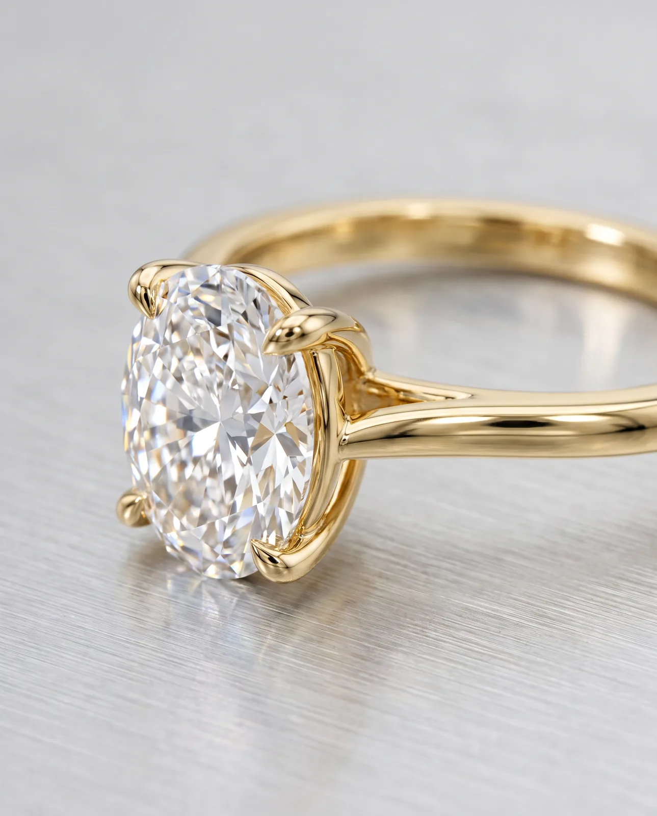 Nano Banana Pro output: macro of the oval diamond and four gold claw prongs on brushed aluminum